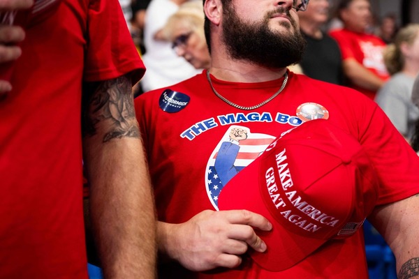 What is the acronym for Donald Trump's slogan ?