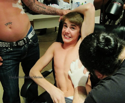 Combien de tatouages a Justin en cette année 2013 ?
