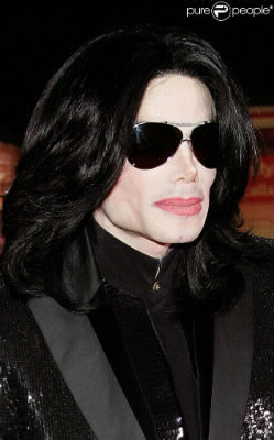 Avec qui Michael Jackson enregistre-t-il de nouvelles chansons en 2006 ?