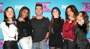 Qui les a transformé en groupe lors de leur auditions au X Factor ?