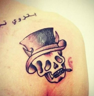 Qui a ce tatoo ?