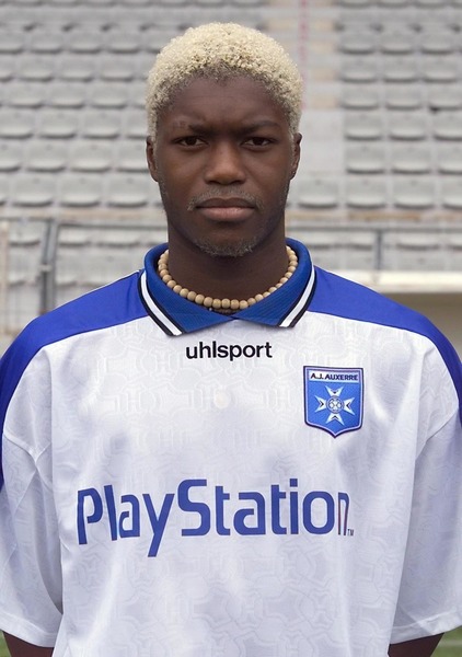 Lors de quelle saison Djibril a-t-il disputé sa première rencontre en Division 1 sous les couleurs de l'AJ Auxerre ?