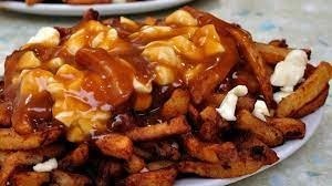 Quel mets québécois se compose de frites, de cheddar en grains et de sauce brune ?