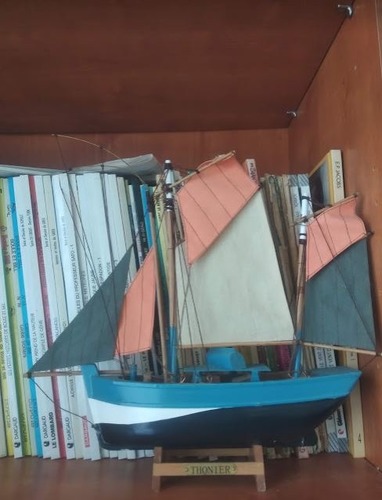 The boat is .......................... of the books.