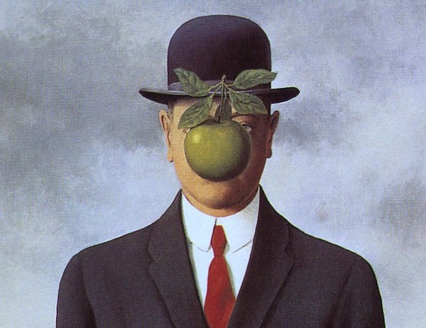 Quel peintre belge a employé une pomme pour appuyer son travail sur les mots ?